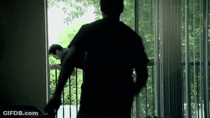 Man Stopping Jumping Out Window GIF