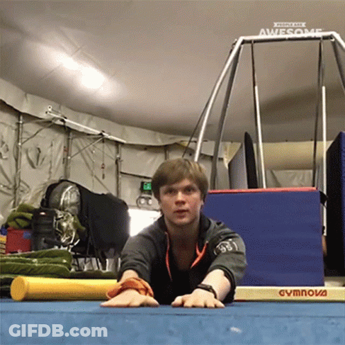 Man Stretching On Gymnova Mat In Gym GIF