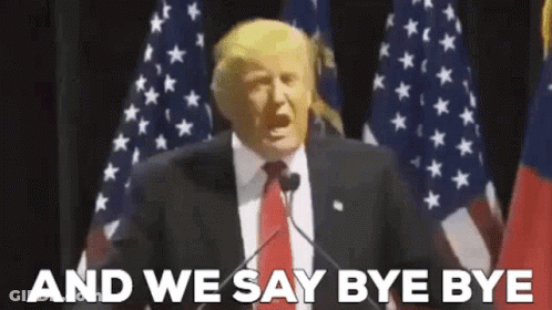 Man Suit And Tie Speaking At American Flag GIF