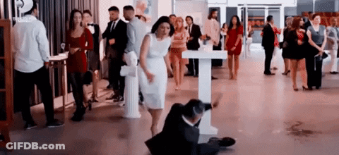 Man Suit Sitting Woman White Dress Behind GIF