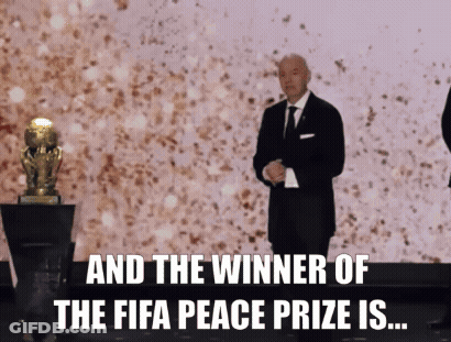 Man Suit Tie Trophy FIFA Peace Prize Winner GIF