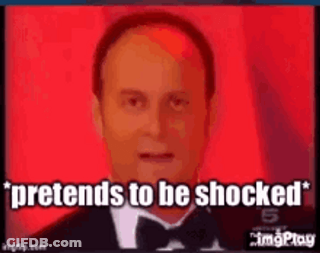 Man Suite Pretends To Be Shocked GIF