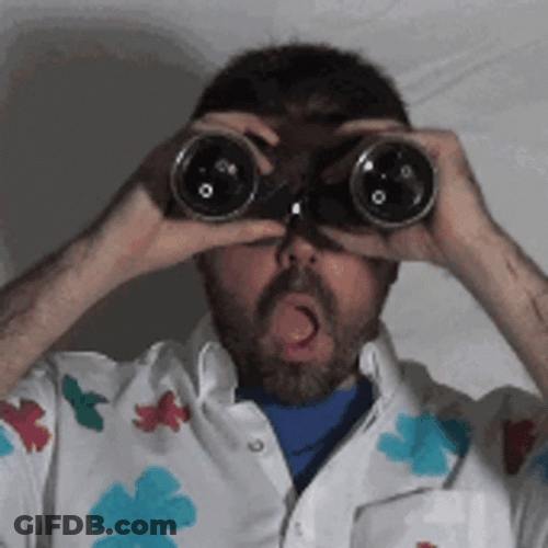 Man Surprised Looking At Binoculars GIF