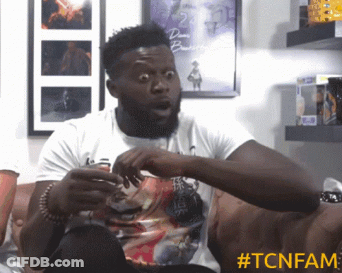 Man Surprised Sitting On Couch GIF