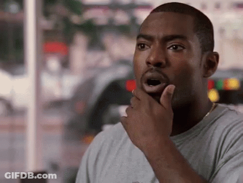 Man Surprised With Hand To Chin GIF