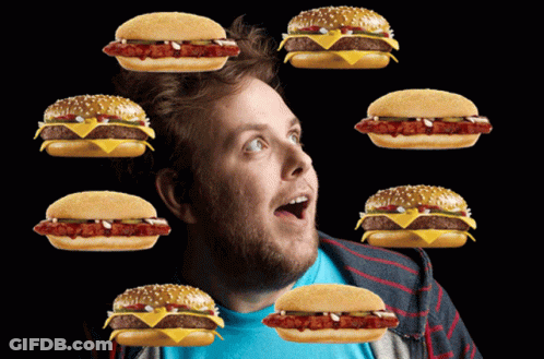 Man Surrounded By Hamburgers With Hot Dog GIF