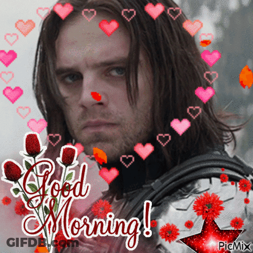 Man Surrounded By Hearts And Flowers Saying Good Morning GIF