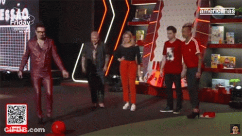 Man Surrounded By Soccer Balls Saying Gol Caracol GIF