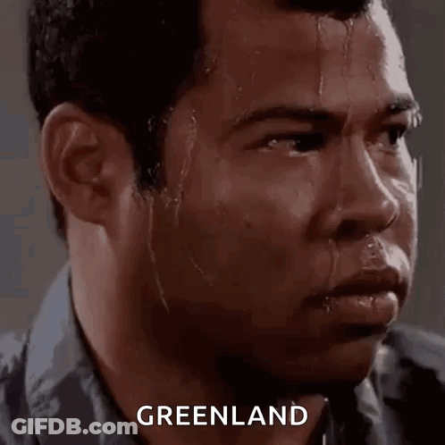 Man Sweating Looking At Camera With Greenland Above GIF