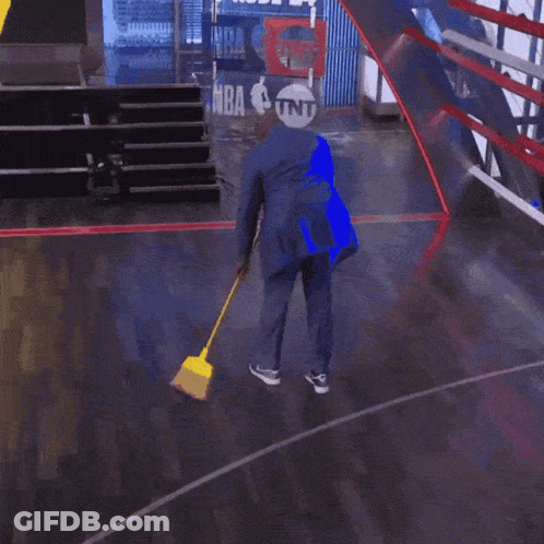 Man Sweeping Floor In Suit GIF