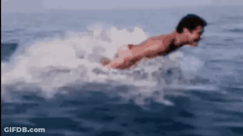Man Swimming In Ocean Without Shirt GIF