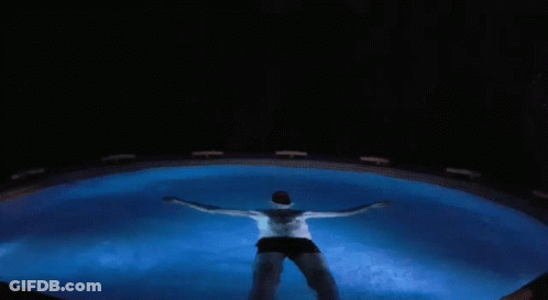 Man Swimming In Pool At Night GIF