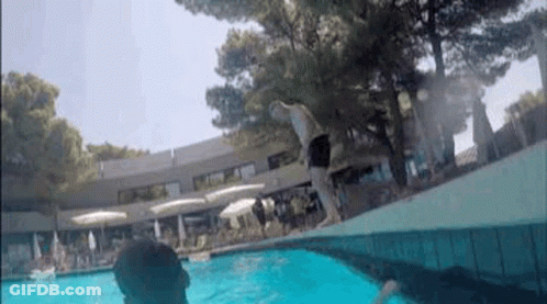 Man Swimming In Pool With Trees GIF