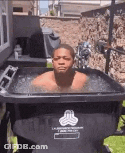 Man Swimming In Trash Can With Ice GIF