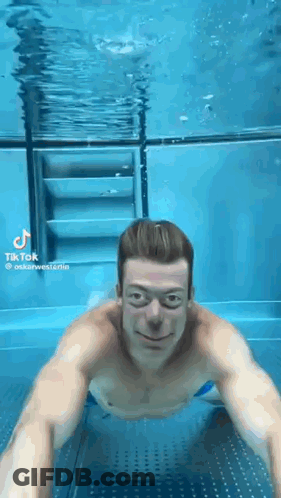 Man Swimming Underwater GIF