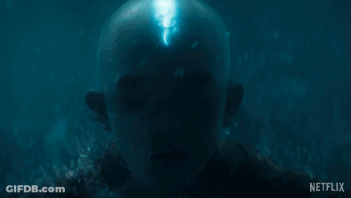 Man Swimming With Glowing Eyes GIF