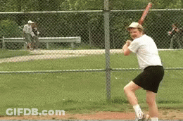 Man Swinging Baseball Bat At Ball GIF