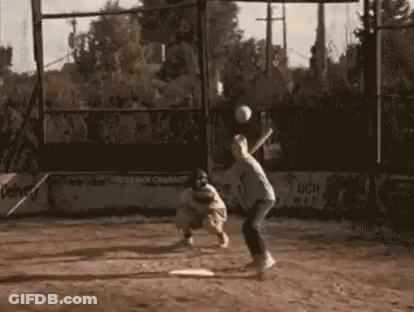 Man Swinging Bat At Baseball Catcher GIF