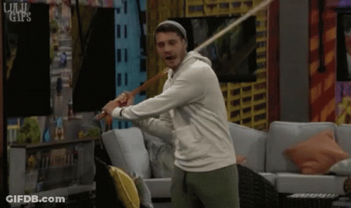 Man Swinging Bat In Living Room GIF