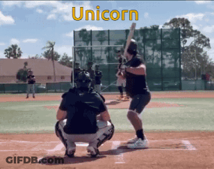 Man Swinging Bat On Baseball Field GIF