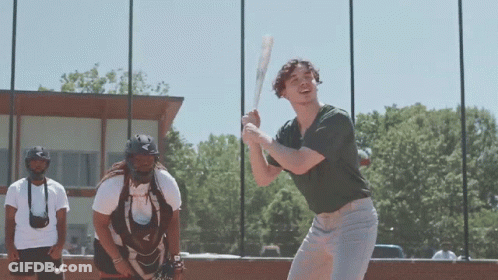 Man Swinging Bat While Catcher Watches GIF
