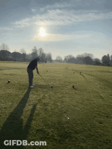 Man Swinging Golf Club GIF