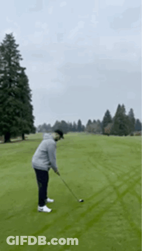 Man Swinging Golf Club GIF