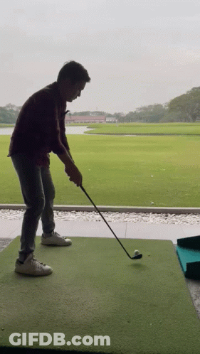 Man Swinging Golf Club GIF