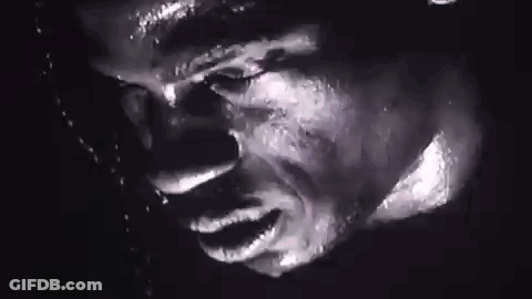Man Swinging Golf Club Another Man Watches GIF