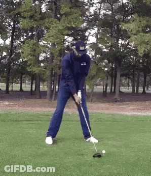 Man Swinging Golf Club At Ball GIF