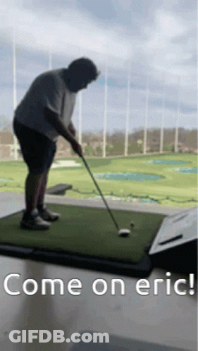 Man Swinging Golf Club At Golf Ball GIF