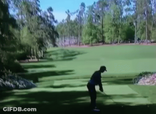 Man Swinging Golf Club At Green GIF