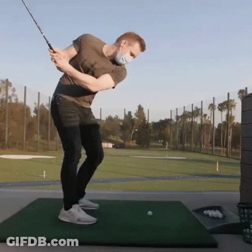 Man Swinging Golf Club In Mask GIF