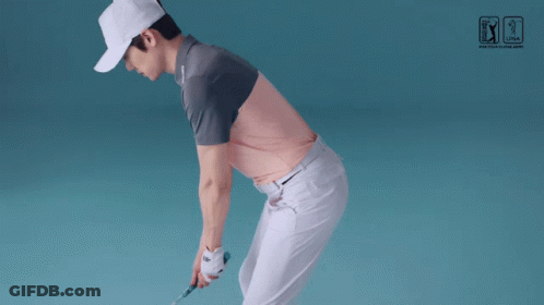 Man Swinging Golf Club Near PGA Tour Sign GIF