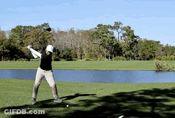 Man Swinging Golf Club Near Pond GIF