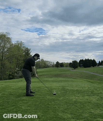 Man Swinging Golf Club On Green GIF