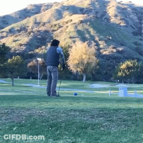 Man Swinging Golf Club GIF