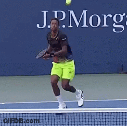 Man Swinging Tennis Racket GIF
