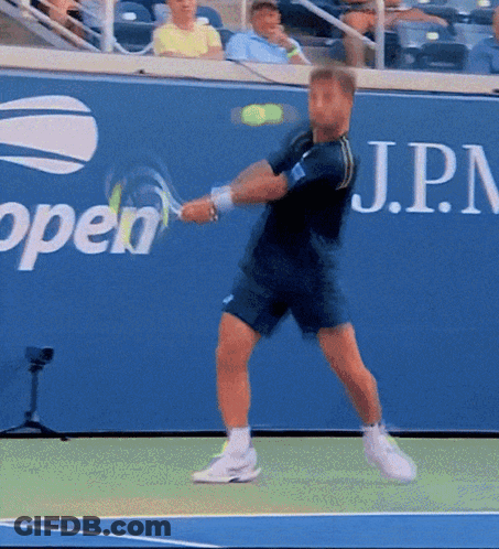 Man Swinging Tennis Racket GIF