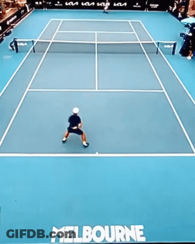 Man Swinging Tennis Racket With 1573 Sign GIF