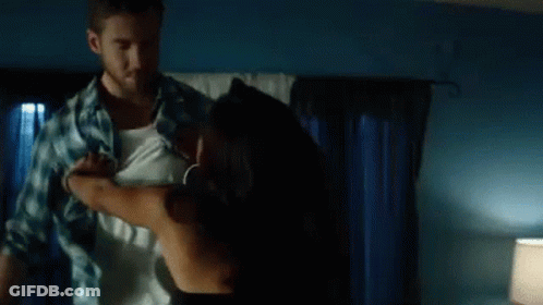 Man Taking Off Woman's Shirt GIF
