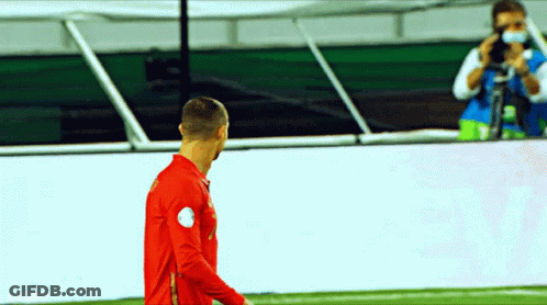 Man Taking Photo Of Soccer Player GIF
