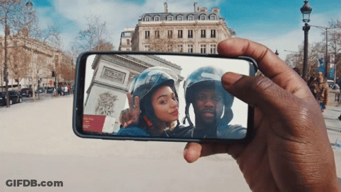 Man Taking Photo Of Woman And Man With Helmet GIF