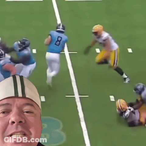 Man Taking Picture Of Football Player In Number 79 Jersey GIF