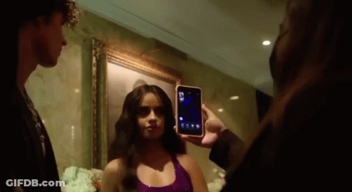 Man Taking Picture Of Woman It's Giving Cher GIF