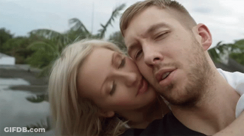 Man Taking Picture Of Woman On Bed GIF