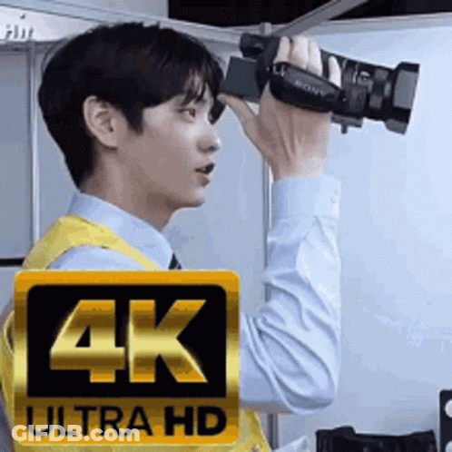 Man Taking Picture With 4K Ultra HD Camera GIF