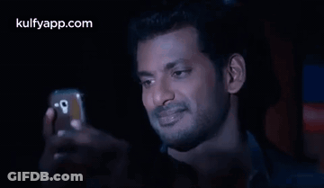 Man Taking Selfie In Dark Room GIF