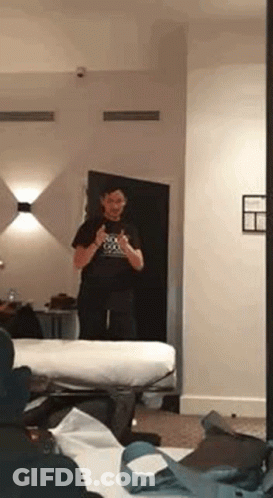 Man Taking Selfie In Hotel Mirror GIF