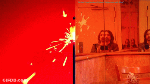 Man Taking Selfie In Mirror With Red Background GIF